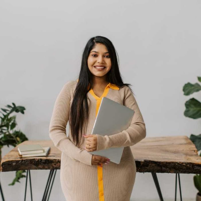 team member standing in front of desk
